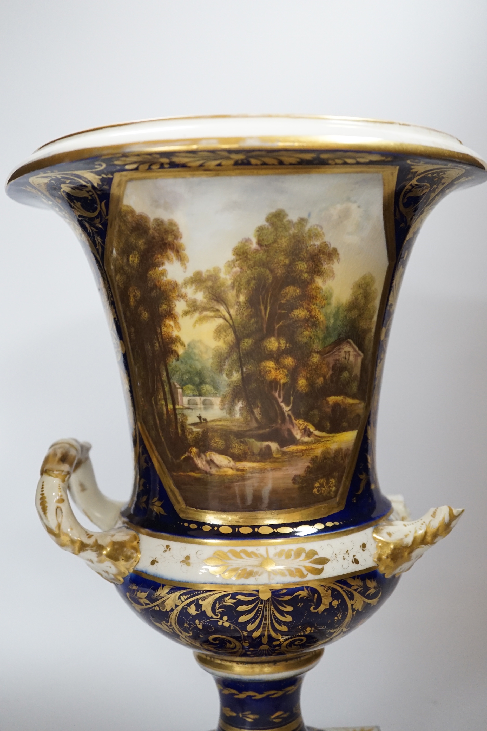 A large Crown Derby campana shaped urn, painted with a view on the river Derwent, circa 1815-20, 33cm